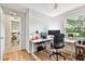 Office features a window, neutral walls, and modern furniture at 344 Cascade Ln, Palm Harbor, FL 34684