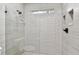The shower features glass doors, light tile, a window, and modern fixtures at 344 Cascade Ln, Palm Harbor, FL 34684