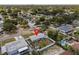 Real estate aerial view of home, fenced yard, situated in a vibrant residential community at 3490 57Th St, St Petersburg, FL 33710