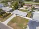 Real estate aerial view of home, paved driveway, fenced yard, well kept neighborhood at 3490 57Th St, St Petersburg, FL 33710