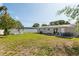 Expansive backyard with seating areas, fire pit, and ample green space, perfect for outdoor activities at 3490 57Th St, St Petersburg, FL 33710