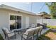 Outdoor living space with patio, dining set, and comfortable seating area at 3490 57Th St, St Petersburg, FL 33710