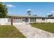 Attractive single-Gathering home with a paved driveway, single car garage, and a well-manicured front lawn at 3490 57Th St, St Petersburg, FL 33710