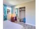 Comfortable bedroom with closet, wood-look flooring, and bright natural light at 3910 14Th N Ave, St Petersburg, FL 33713