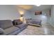 Spacious bedroom featuring a sitting area, wood-look floors, and natural light at 3910 14Th N Ave, St Petersburg, FL 33713