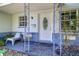 Charming front porch with seating and a decorative entryway at 3910 14Th N Ave, St Petersburg, FL 33713