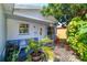Inviting front porch with lush greenery, seating, and unique architectural details at 3910 14Th N Ave, St Petersburg, FL 33713