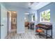 Well-lit office with vintage desk, hardwood floors, and ample natural light at 3910 14Th N Ave, St Petersburg, FL 33713