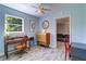 Well-lit office with vintage desk, hardwood floors, and ample natural light at 3910 14Th N Ave, St Petersburg, FL 33713