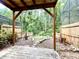 Picturesque backyard featuring a stone paver walkway and a tranquil, wooded backdrop at 4006 Huxford Ct, Tampa, FL 33624