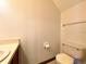 Cozy bathroom featuring a toilet, vanity, and classic tile flooring at 4006 Huxford Ct, Tampa, FL 33624