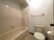 Bathroom featuring a tub and shower combination, standard height toilet and standard fixtures at 4006 Huxford Ct, Tampa, FL 33624