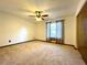 Spacious bedroom with a ceiling fan and a bright window dressed with patterned curtains at 4006 Huxford Ct, Tampa, FL 33624