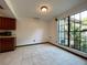 Bright dining area with large windows and tile flooring at 4006 Huxford Ct, Tampa, FL 33624