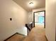 Second floor hallway featuring wall-to-wall carpeting, wood railing and light fixture at 4006 Huxford Ct, Tampa, FL 33624