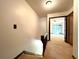 Second floor hallway featuring wall-to-wall carpeting, wood railing and light fixture at 4006 Huxford Ct, Tampa, FL 33624