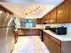 Spacious kitchen with stainless steel appliances, tiled floors and wood cabinets at 4006 Huxford Ct, Tampa, FL 33624
