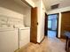 Functional laundry area with a washer and dryer conveniently located near the hallway at 4006 Huxford Ct, Tampa, FL 33624