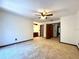 Spacious bedroom featuring carpet, ceiling fan, and access to the ensuite bathroom at 4006 Huxford Ct, Tampa, FL 33624
