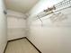 Walk-in closet with plenty of storage with shelving and tile flooring at 4006 Huxford Ct, Tampa, FL 33624