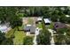 Rural property with a home, outbuildings and an expansive manicured yard at 408 River Bed Ct, Wimauma, FL 33598