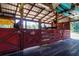 Barn stall, perfect for hobby farming or horse keeping, features open beams and a sturdy wooden structure at 408 River Bed Ct, Wimauma, FL 33598