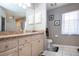 Well-lit bathroom features a vanity with lots of cabinet space and decorative countertop at 408 River Bed Ct, Wimauma, FL 33598