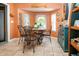 Charming dining area with seating for four and ample natural light at 408 River Bed Ct, Wimauma, FL 33598
