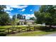 Well-manicured lawn and landscaping enhance this home's curb appeal at 408 River Bed Ct, Wimauma, FL 33598