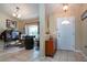 Welcoming foyer with tile flooring, cabinet, and bar area visible at 408 River Bed Ct, Wimauma, FL 33598