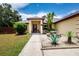 Manicured landscaping highlights the front entrance of this charming single Gathering home at 408 River Bed Ct, Wimauma, FL 33598