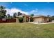 Well-maintained front lawn and mature landscaping at 408 River Bed Ct, Wimauma, FL 33598