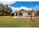 This charming single Gathering home features a well-manicured front yard at 408 River Bed Ct, Wimauma, FL 33598