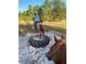 A young girl enjoys horseback riding on this horse property at 408 River Bed Ct, Wimauma, FL 33598