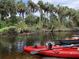 Kayaks sit on the Little Manatee River, ready for exploring at 408 River Bed Ct, Wimauma, FL 33598