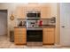 Updated kitchen with stainless steel range, and neutral toned cabinetry at 408 River Bed Ct, Wimauma, FL 33598