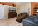 Comfortable living room with tile floors and neutral tones at 408 River Bed Ct, Wimauma, FL 33598