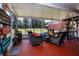 Spacious screened patio, perfect for entertaining, featuring comfortable wicker furniture and views of the backyard at 408 River Bed Ct, Wimauma, FL 33598