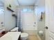 The bathroom has a toilet, vanity and tub with shower at 4116 Knollpoint Dr, Wesley Chapel, FL 33544