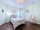 This bedroom has a hanging chair, decorative wall hangings and a window at 4116 Knollpoint Dr, Wesley Chapel, FL 33544