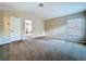 Bedroom has neutral walls, carpet floor and good light at 4116 Knollpoint Dr, Wesley Chapel, FL 33544