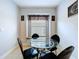 Bright breakfast nook with a glass-topped table and window at 4116 Knollpoint Dr, Wesley Chapel, FL 33544