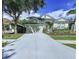 Charming single-Gathering home with well-manicured lawn and inviting curb appeal at 4116 Knollpoint Dr, Wesley Chapel, FL 33544