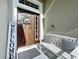 A welcoming front entrance with a bench, decorative wreath, and a 