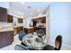 Spacious kitchen featuring stainless steel appliances, an island, and a cozy breakfast nook at 4116 Knollpoint Dr, Wesley Chapel, FL 33544