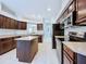 Well-equipped kitchen featuring stainless steel appliances, ample counter space, and a central island at 4116 Knollpoint Dr, Wesley Chapel, FL 33544