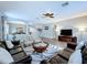 Inviting living room boasting hardwood floors, leather furniture, and a decorative rug at 4116 Knollpoint Dr, Wesley Chapel, FL 33544