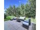 Cozy outdoor patio area, furnished with comfortable seating, perfect for relaxing or entertaining guests at 4116 Knollpoint Dr, Wesley Chapel, FL 33544