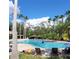 Community pool with multiple chairs for residents to enjoy a sunny day at 4116 Knollpoint Dr, Wesley Chapel, FL 33544