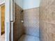 Tiled stand-up shower with rainfall shower head at 4116 Knollpoint Dr, Wesley Chapel, FL 33544